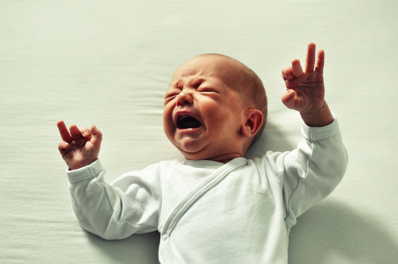 Infant after looking attentively at caregiver, reflecting emotional awareness and early emotion understanding in online therapy Maryland and DC.
