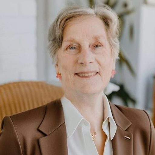 Headshot of virtual therapist featured in tv interview in Maryland and Washington, DC with Dr. Gloria Vanderhorst in brown suit