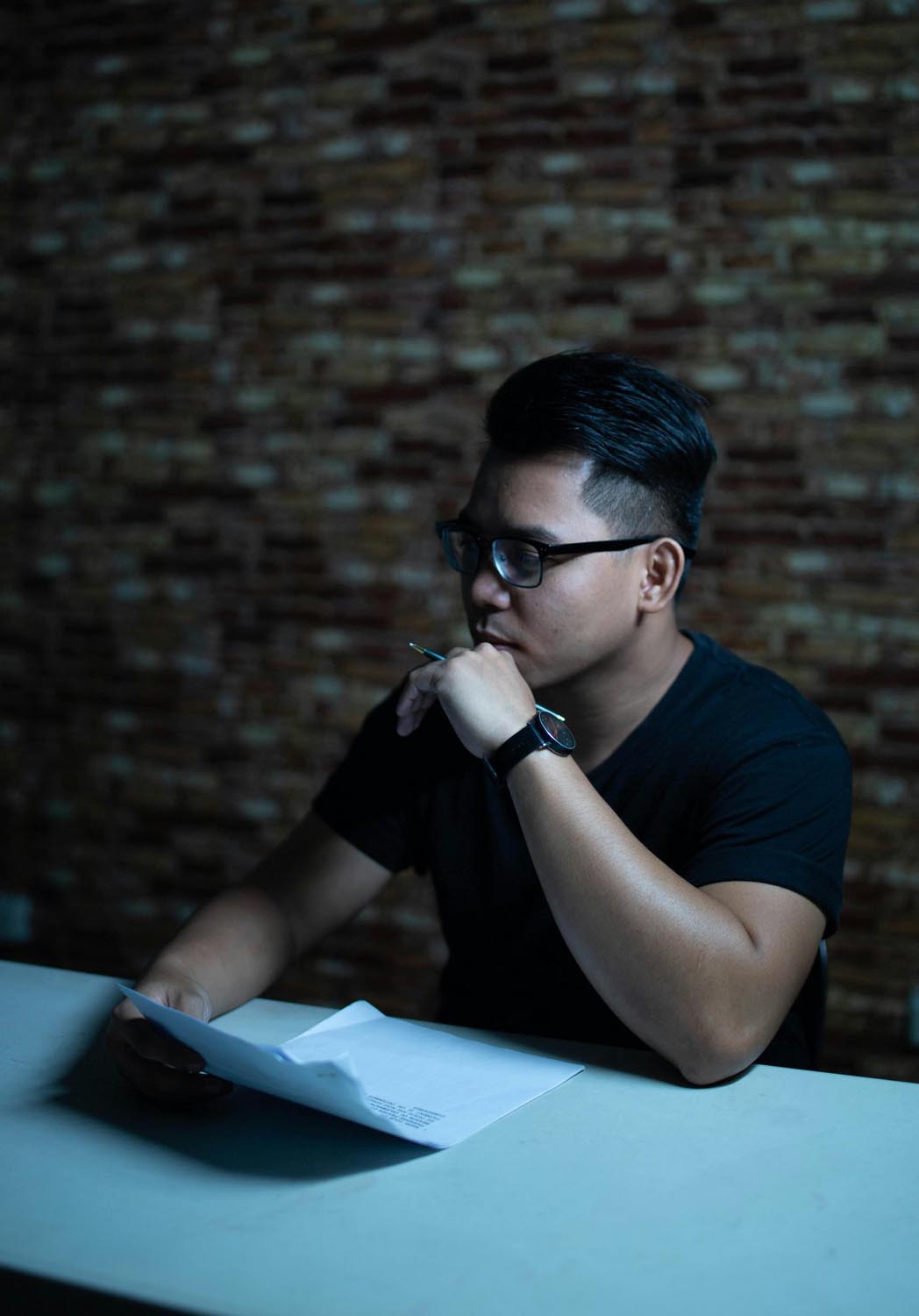 A man looking at a smartphone in the distance, symbolizing emotional connection and reconnection and digital detox in Maryland and DC.