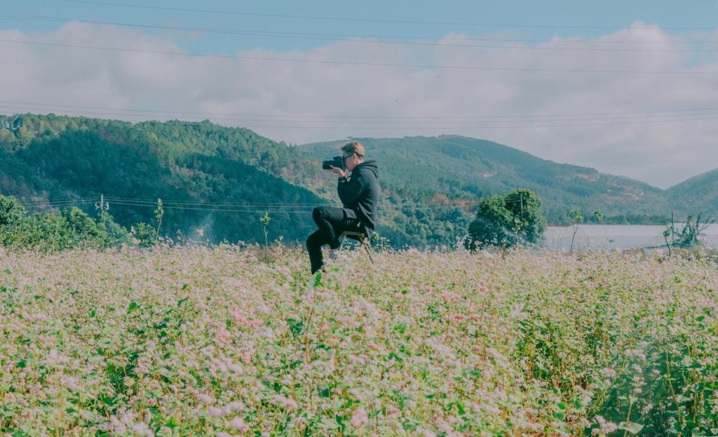 A woman reflecting on finding self love and into a field with soft light, symbolizing self-reflection and emotional insight in Maryland and DC.