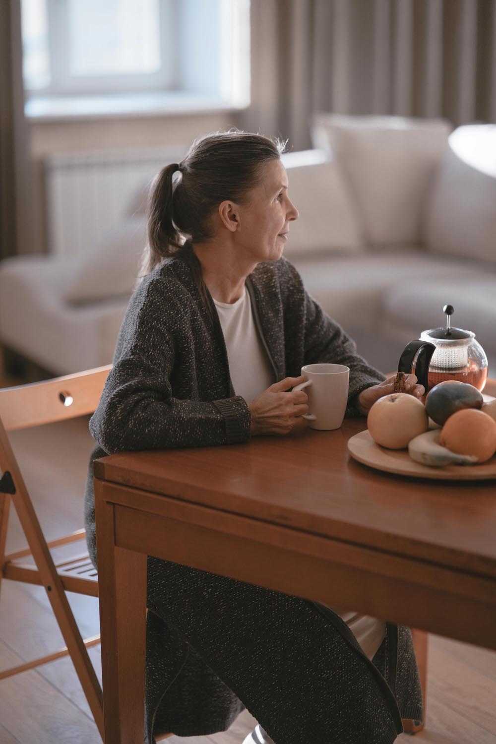 A women with motherly instinct watching a child holding a large stuffed aardvark, symbolizing trust, promises, and emotional connection in Maryland and DC.