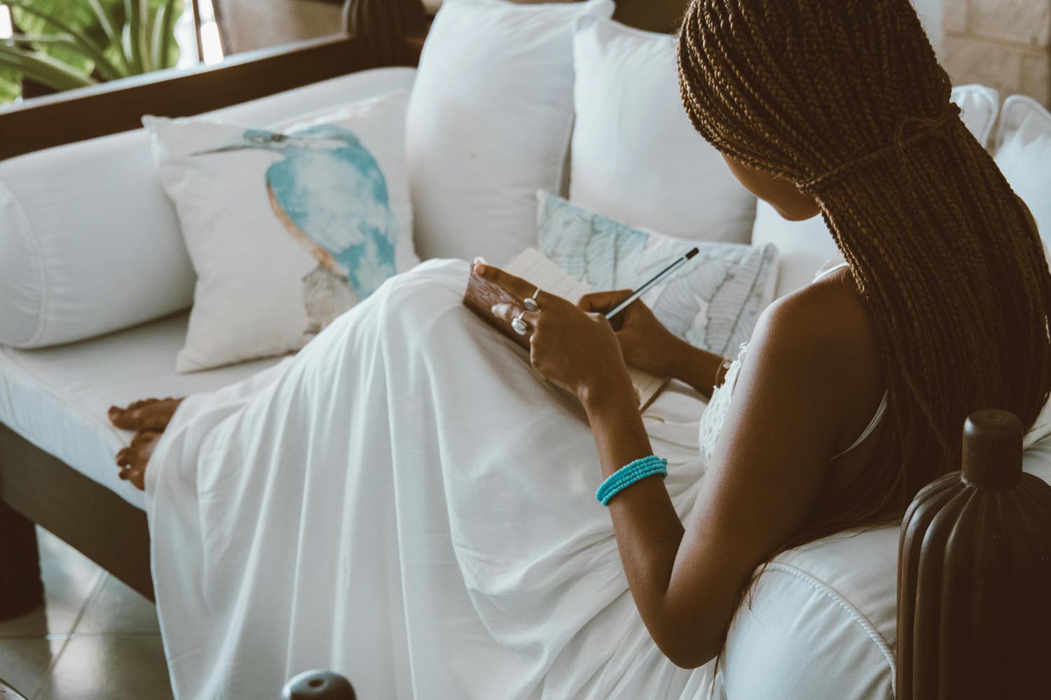 A woman practicing her daily journaling ritual, symbolizing mindfulness and emotional reflection in Washington, DC.
