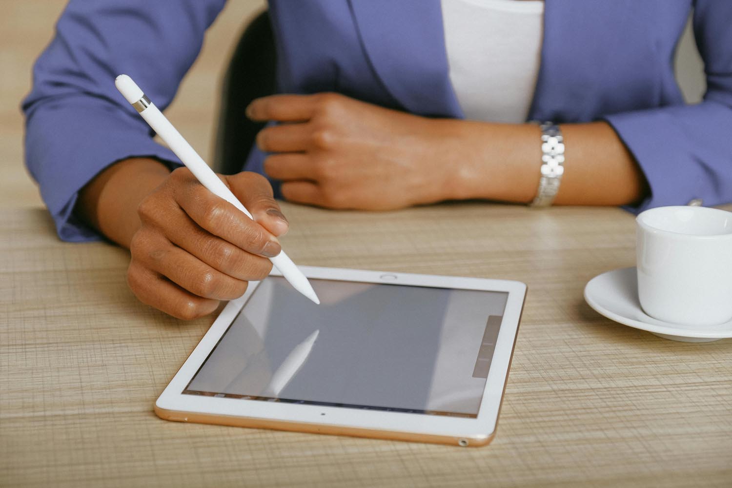 Woman after unplugging, searching for a biscuit and gravy recipe on a tablet with batteries nearby after asking what's on your plate, symbolizing memory and emotional reflection in Maryland and DC.