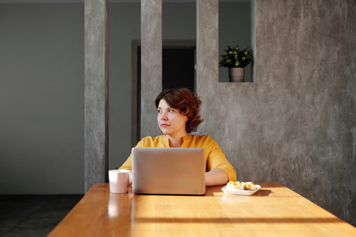 A woman looking up cake and soup recipes, symbolizing emotional connection and a sense of inclusion in Maryland and DC.