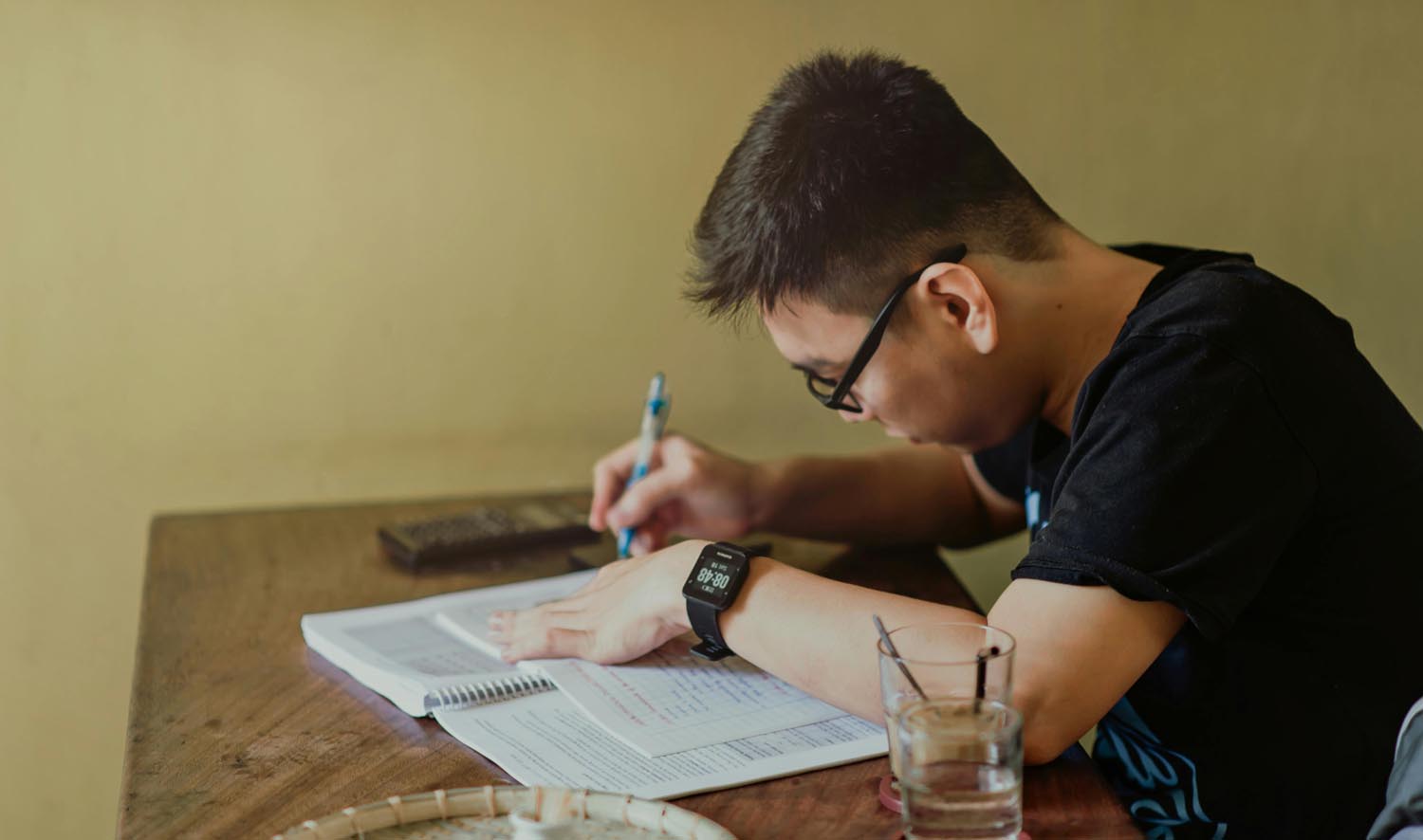 A person writing an apology note after being caught in scams, symbolizing vulnerability, emotional growth, and conscience in Maryland and DC.