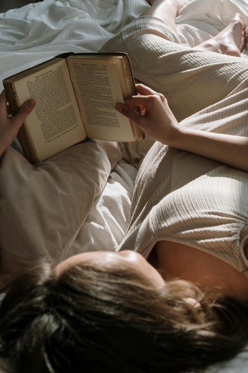 A person being satisfied by reading an essay, symbolizing intuition and emotional appreciation in Maryland and DC.