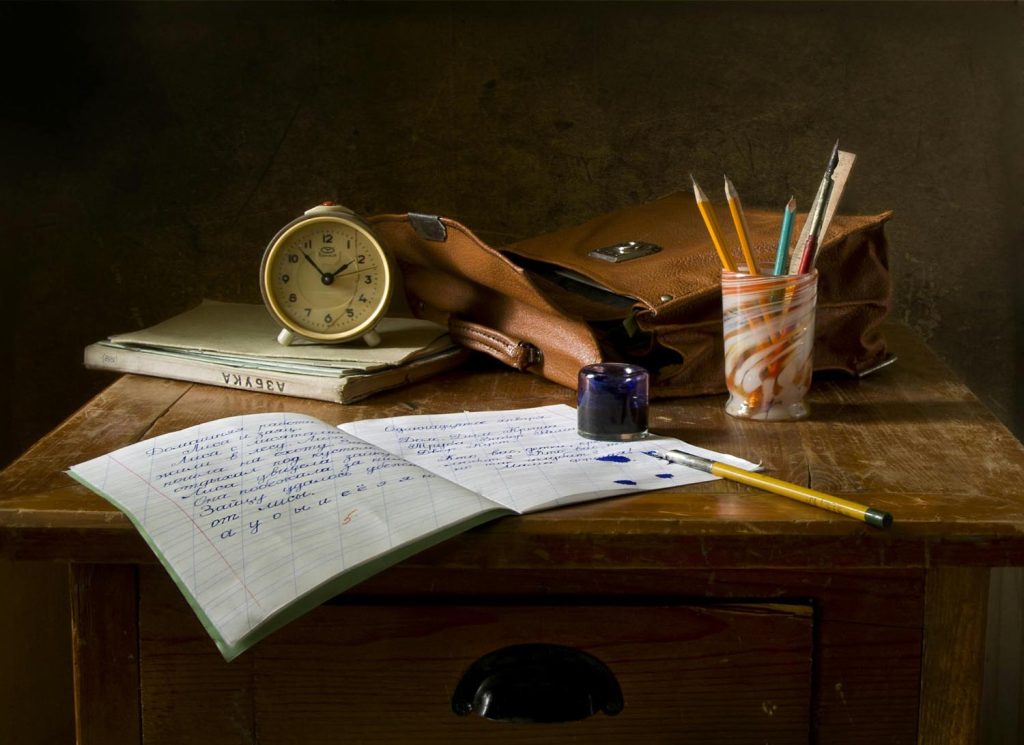 Old desk near a window, symbolizing family histories, imagination, and resourcefulness in Maryland and DC.