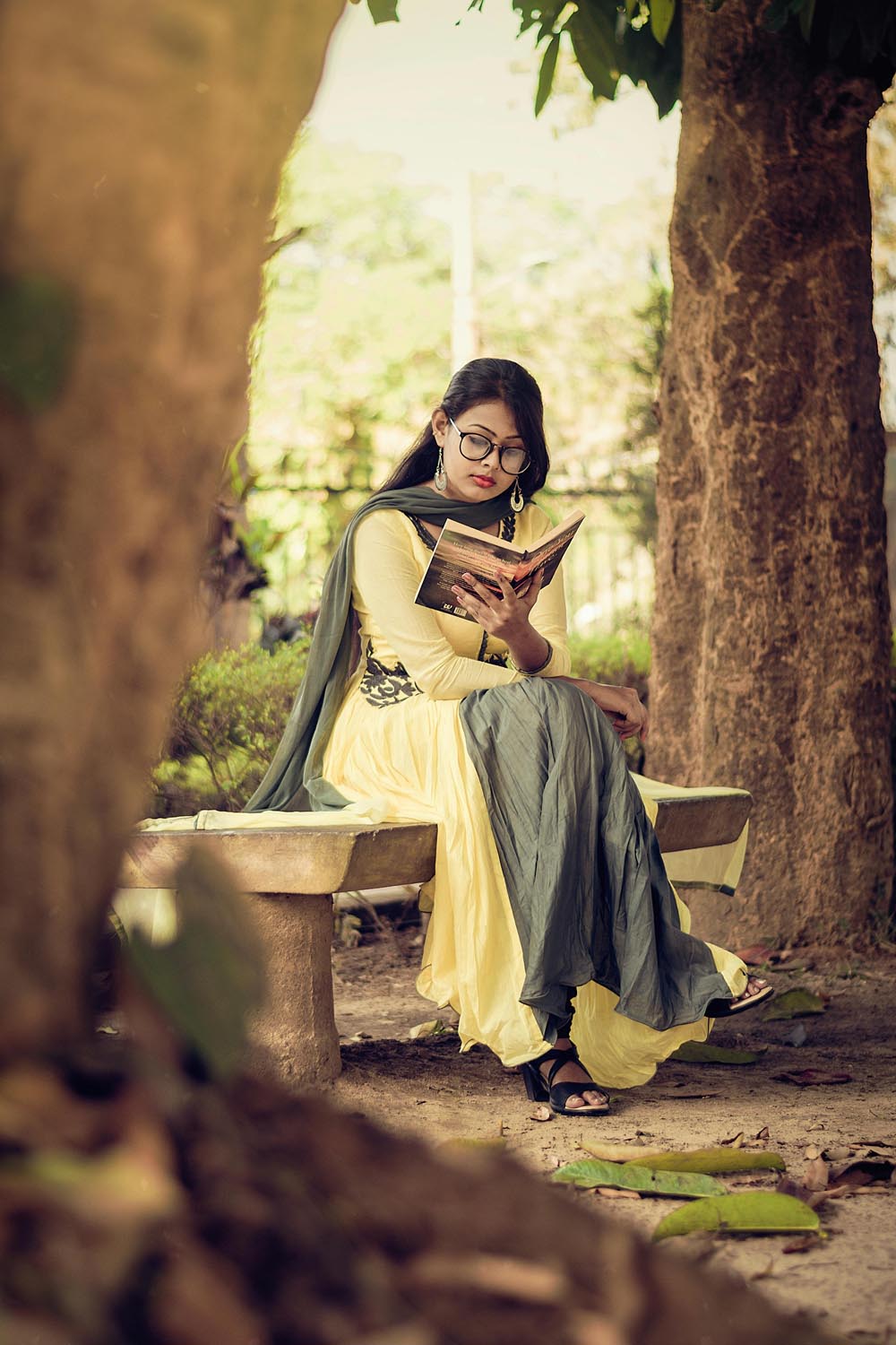 Woman sitting confidently with a journal writing about the ways we wander, symbolizing reflection and empowerment through feminist therapy in Maryland and DC.