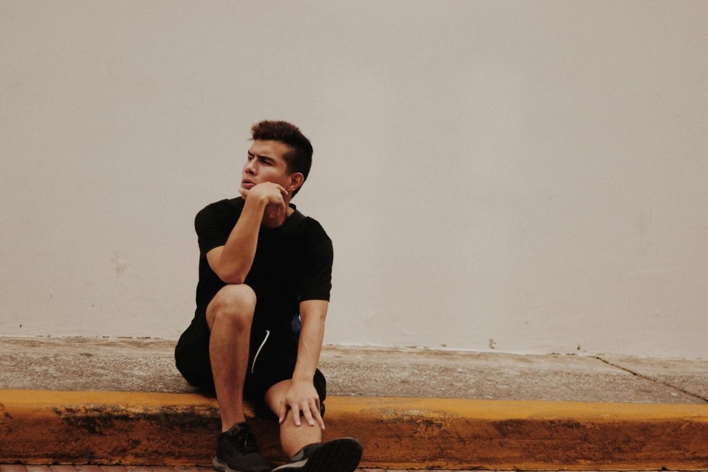 Man reflecting on Emotional Freedom in co-parenting challenges and growth after divorce, illustrating how therapy in Maryland and DC supports families moving from conflict to connection.